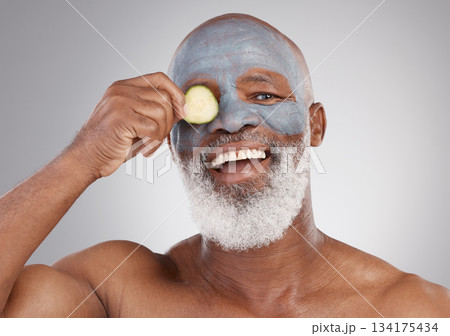 Facial mask, cucumber and black man with smile in portrait, beauty and skincare isolated on studio background. Happy senior male, cosmetic care and healthy skin, anti aging cosmetics routine for face Facial mask, cucumber and black man with smile in portrait, beauty and skincare isolated on studio background. Happy senior male, cosmetic care and healthy skin, anti aging cosmetics routine for face 134175434