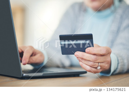 Laptop, credit card and hands typing for online shopping, digital banking or payment in home. Computer, ecommerce and woman on internet for sales, finance or fintech purchase, savings or investment. 134175621