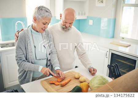 Cooking, food and an old couple in the kitchen of their home together during retirement for meal preparation. Health, wellness or nutrition with a senior man and woman making supper in their house Cooking, food and an old couple in the kitchen of their home together during retirement for meal preparation. Health, wellness or nutrition with a senior man and woman making supper in their house 134175622