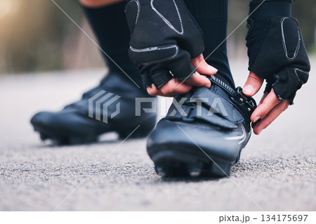 Fitness, shoes and closeup with woman in road for running, workout and sports challenge. Cardio, exercise and race with female runner fix sneakers in outdoors for training, strong and performance 134175697