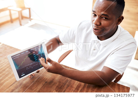 Black man, trader and tablet on stock market in trading, coaching or financial graph, chart or investing data. Businessman, trader or broker showing finance investment, crypto or profit on technology 134175977