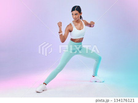 Fitness, woman and fighting pose in studio for karate, martial arts or defence training on gradient background. Power, sports and indian female in intense workout, exercise and posing while isolated Fitness, woman and fighting pose in studio for karate, martial arts or defence training on gradient background. Power, sports and indian female in intense workout, exercise and posing while isolated 134176121