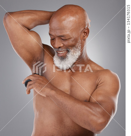 Skincare, shaving armpit and black man with a smile, grooming and routine with guy against a dark studio background. Senior male, happy person and model with hygiene, cosmetics and hair removal 134176315