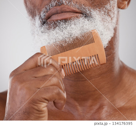 Man, hands and comb on beard for grooming, beauty or skincare hygiene against a studio background. Closeup of senior male neck and chin combing or brushing facial hair for clean wellness or haircare Man, hands and comb on beard for grooming, beauty or skincare hygiene against a studio background. Closeup of senior male neck and chin combing or brushing facial hair for clean wellness or haircare 134176395
