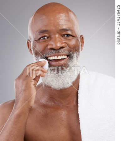 Skincare, cotton pad and portrait of man with happiness, cleaning or luxury bathroom routine. Dermatology, cosmetic process and happy, mature African model and anti ageing morning cleansing treatment Skincare, cotton pad and portrait of man with happiness, cleaning or luxury bathroom routine. Dermatology, cosmetic process and happy, mature African model and anti ageing morning cleansing treatment 134176425