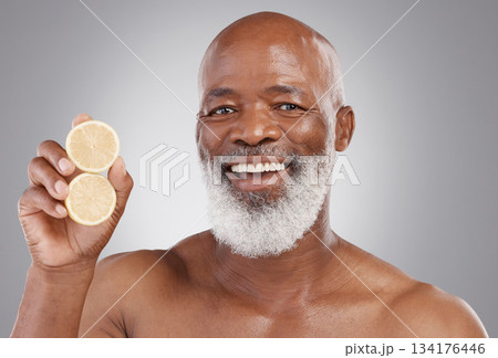 Senior black man, portrait smile and fruit for vitamin C, skincare or natural nutrition against gray studio background. Happy African American male and citrus lemon for healthy skin, diet or wellness Senior black man, portrait smile and fruit for vitamin C, skincare or natural nutrition against gray studio background. Happy African American male and citrus lemon for healthy skin, diet or wellness 134176446