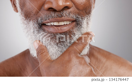 Beauty, hand and beard with a senior man in studio on a gray background for skincare or grooming. Mouth, smile and facial hair with a happy mature male closeup for a luxury cosmetic facial product 134176447