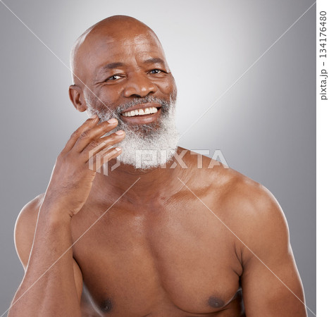 Senior black man, portrait smile and skincare cosmetics, grooming or personal hygiene profile against a gray studio background. Happy African American elderly male smiling for healthy or perfect skin 134176480