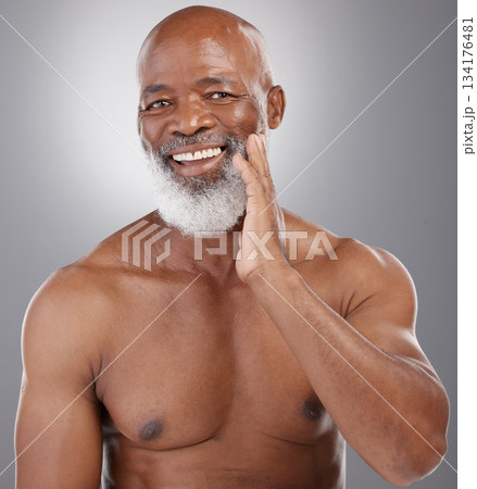 Senior black man, portrait smile and skincare for grooming, hygiene or facial treatment against gray studio background. Happy African American elderly male smiling for beauty skin, self love or care Senior black man, portrait smile and skincare for grooming, hygiene or facial treatment against gray studio background. Happy African American elderly male smiling for beauty skin, self love or care 134176481