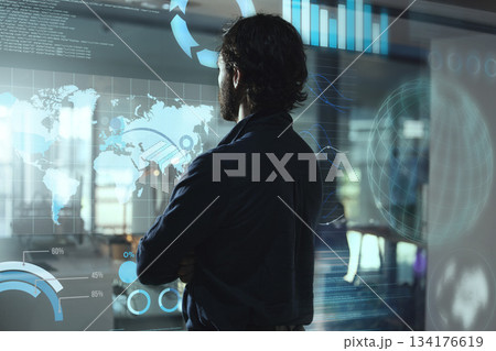 Monitor hologram, business man and data analytics for global networking, worldwide technology or digital software.. Holographic screen of statistics and global information and person, night and rear 134176619