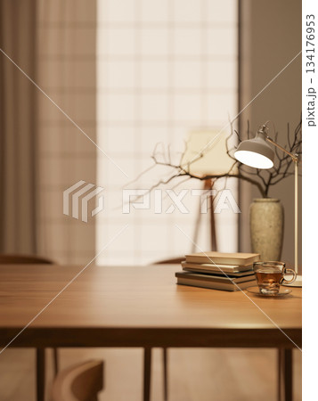Coffee in glass cup with book and vase aside lamp on wooden table across wall window in warm light. 134176953