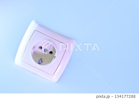 Electrical socket for connecting devices in pale blue light Electrical socket for connecting devices in pale blue light 134177288