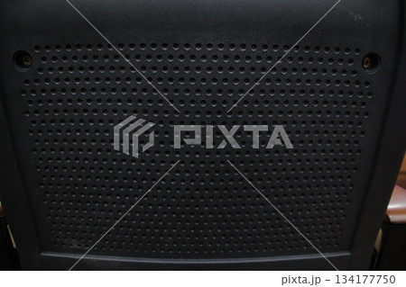 Black perforated plastic texture background detail pattern. 134177750