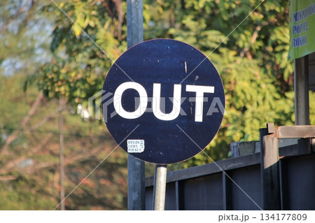 Circular Black and White Sign Indicating the Exit Direction 134177809