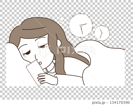 A woman staying up late at night looking at her smartphone A woman staying up late at night looking at her smartphone 134178390
