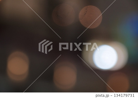 Bokeh round light circles in dark abstract background pattern. Bokeh round light circles in dark abstract background pattern. 134179731