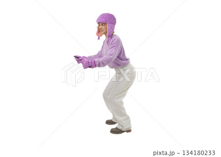 Cheerful skier dressed warmly enjoys winter activities, isolated, PNG 134180233
