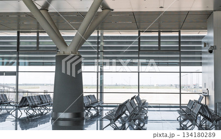 Modern architectural column and glass facade inside Siem Reap Angkor International Airport terminal building interior design in Cambodia on December 2 2025 134180289