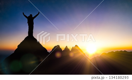 Silhouette of happy hiker man standing on mountain peak with raised hands during beautiful sunset or sunrise achievement success concept Silhouette of happy hiker man standing on mountain peak with raised hands during beautiful sunset or sunrise achievement success concept 134180293
