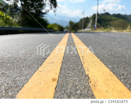 Yellow traffic line color Double solid lines to warn prohibiting overtaking, Yellow continuous tracks of prohibited overtaking painted on the asphalt, Safety driving and traffic regulating rules 134181873