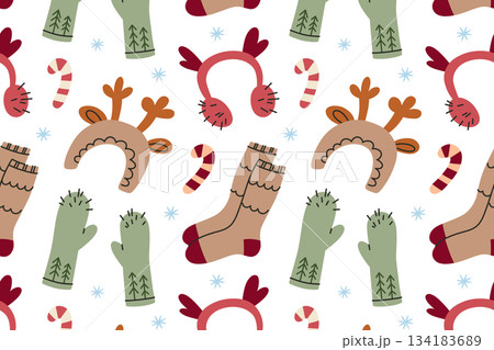 Flat cartoon vector illustration, cozy winter pattern with wool socks, mittens, reindeer headbands, candy canes and snowflakes, festive holiday mood, seamless design for Christmas decor 134183689