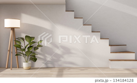 High floor lamp and potted plant with sunlight shining on white stairs wall and wooden parquet floor 134184128