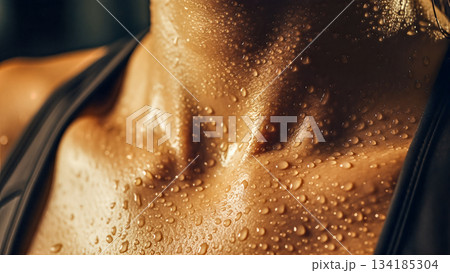 Macro close up of female neck skin texture with water sweat drops during intensive sport workout training in gym fitness center Macro close up of female neck skin texture with water sweat drops during intensive sport workout training in gym fitness center 134185304