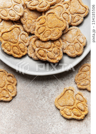 Homemade paw print dog treats on a plate Homemade paw print dog treats on a plate 134185506