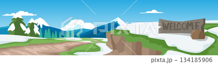 Horizontal or Landscape of soil road to the hills. Welcome sign on the side of the road at a high elevation. Grasslands covered in patches of snow. Background of forest and mountain under blue sky. 134185906