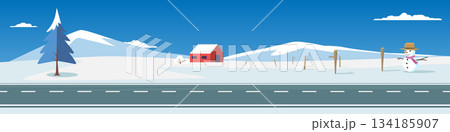 Landscape banner of long stretch of asphalt road. Snow covered hills. Snowman at the entrance to the house and wooden fence with red house. Under clear sky. Clean and empty space background. 134185907
