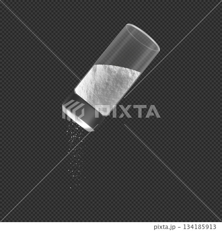 A round glass container with a metal lid pouring salt. Seasoning, ingredient, cooking. A round glass container with a metal lid pouring salt. Seasoning, ingredient, cooking. 134185913