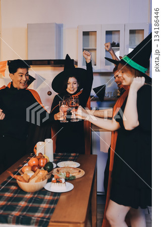 Friends enjoying a Halloween party at a bar making a toast Friends enjoying a Halloween party at a bar making a toast 134186446