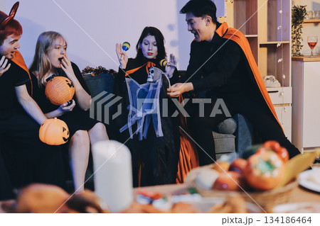 Friends enjoying a Halloween party at a bar making a toast Friends enjoying a Halloween party at a bar making a toast 134186464