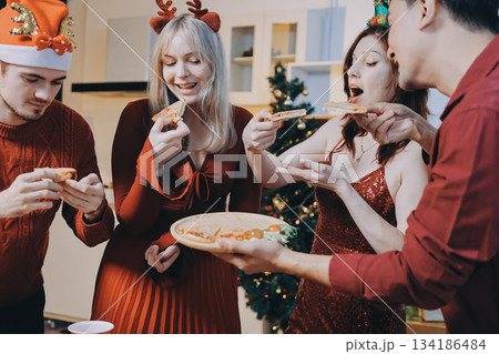 Festive Office Christmas Party with Delicious Food. A beautifully decorated office space with Christmas trees and festive lights, set up for a holiday party. Festive Office Christmas Party with Delicious Food. A beautifully decorated office space with Christmas trees and festive lights, set up for a holiday party. 134186484