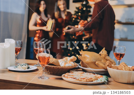 Festive Office Christmas Party with Delicious Food. A beautifully decorated office space with Christmas trees and festive lights, set up for a holiday party. Festive Office Christmas Party with Delicious Food. A beautifully decorated office space with Christmas trees and festive lights, set up for a holiday party. 134186503