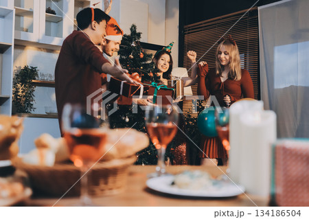 Festive Office Christmas Party with Delicious Food. A beautifully decorated office space with Christmas trees and festive lights, set up for a holiday party. Festive Office Christmas Party with Delicious Food. A beautifully decorated office space with Christmas trees and festive lights, set up for a holiday party. 134186504