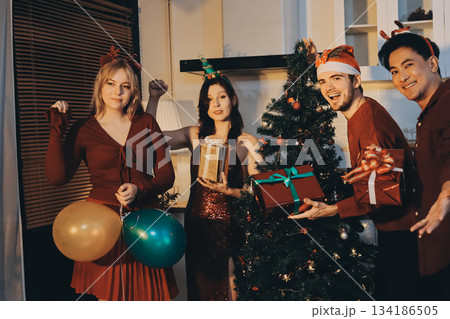 Festive Office Christmas Party with Delicious Food. A beautifully decorated office space with Christmas trees and festive lights, set up for a holiday party. Festive Office Christmas Party with Delicious Food. A beautifully decorated office space with Christmas trees and festive lights, set up for a holiday party. 134186505