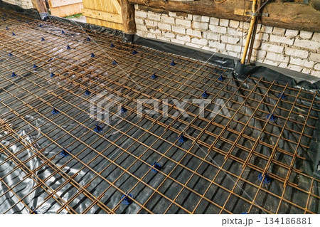 Reinforcement Grid on Black Membrane for Concrete Slab Preparation, Construction Site 134186881