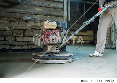 Concrete Finishing Polishing the Surface with a Power Trowel for Smooth Results 134186912