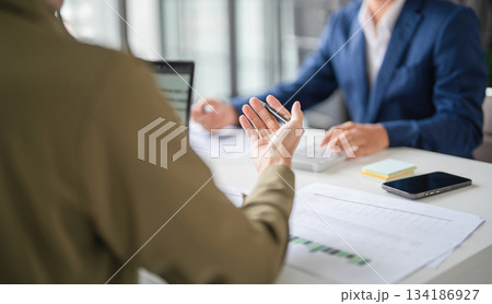 Businessmen drive online store success together. Businessmen drive online store success together. 134186927