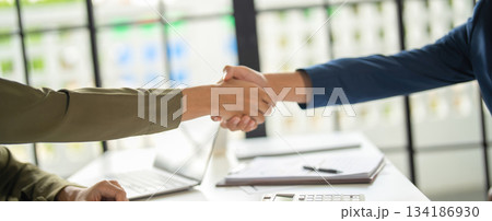 Businessmen shaking hands in agreement. Businessmen shaking hands in agreement. 134186930