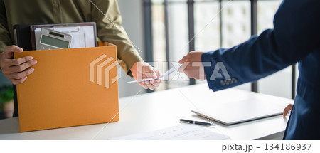 A male employee quits his job. 134186937