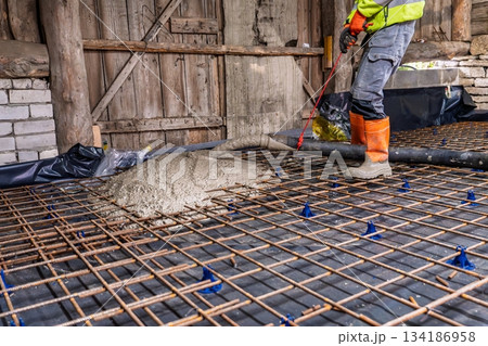 Concrete Pouring for Robust Foundation Construction Site Expertise with Metal Grid Reinforcement Concrete Pouring for Robust Foundation Construction Site Expertise with Metal Grid Reinforcement 134186958