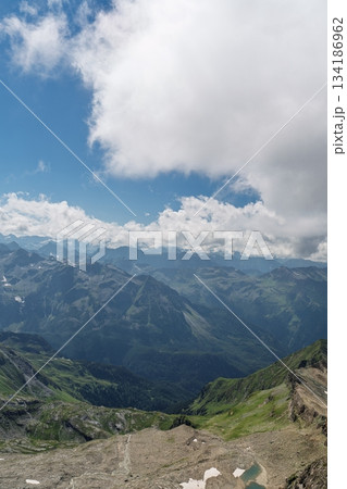 Majestic Mountain Range Vista Under a Sky Full of Clouds, High Altitude Scenery 134186962