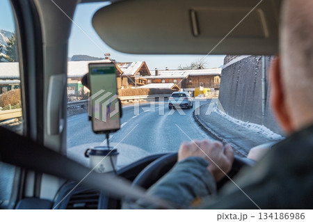 Scenic Winter Drive Navigating Through a Picturesque Village Road Trip Adventure 134186986