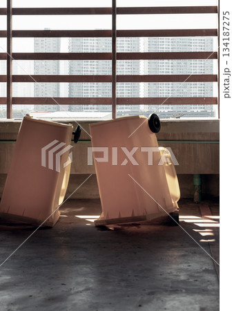 View of After cleaning big plastic yellow garbage container and turn upside down to dry. View of After cleaning big plastic yellow garbage container and turn upside down to dry. 134187275