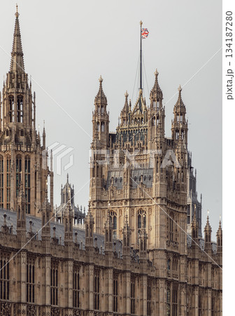Palace of Westminster (the Houses of Parliament), its distinctive Gothic Revival architecture, characterized by intricate stonework and towering spires. Palace of Westminster (the Houses of Parliament), its distinctive Gothic Revival architecture, characterized by intricate stonework and towering spires. 134187280