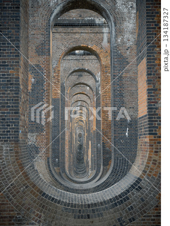Architectural splendour of Ouse Valley Viaduct or Balcombe Viaduct (Railway viaduct) carries the Brighton Main Line over the River Ouse in Sussex. The semi-circular arches vaulting supporting brick Architectural splendour of Ouse Valley Viaduct or Balcombe Viaduct (Railway viaduct) carries the Brighton Main Line over the River Ouse in Sussex. The semi-circular arches vaulting supporting brick 134187327