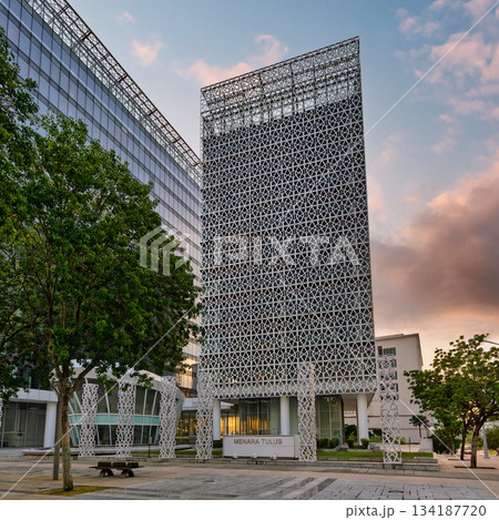 Menara Tulus building with its distinctive geometric facade and modern architecture in Putrajaya, Malaysia at sunset. 134187720