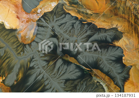 Aerial view of abstract mining pattern, nature pollution, colorful decanting lake Aerial view of abstract mining pattern, nature pollution, colorful decanting lake 134187931